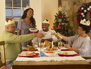 Adult African American family having Christmas dinner