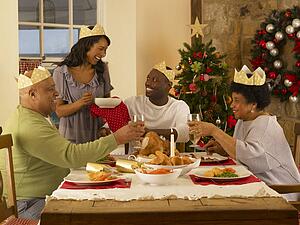 Adult African American family having Christmas dinner