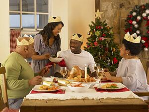 Adult African American family having Christmas dinner