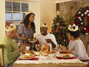 Adult African American family having Christmas dinner