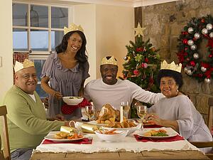 Adult African American family having Christmas dinner