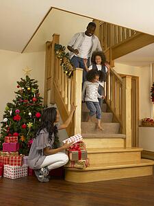 Young African American family on Christmas morning