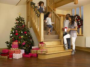Young mixed race family on Christmas morning