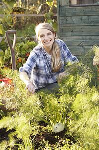 Woman working on allotment