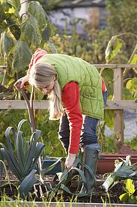 Woman working on allotment
