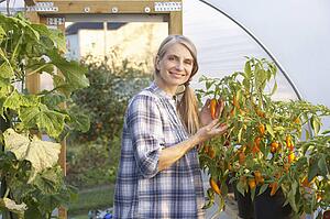 Woman working in greenhouse