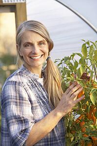 Woman working in greenhouse