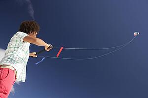 Teenage boy flying a kite