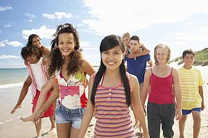 Teenagers walking on beach