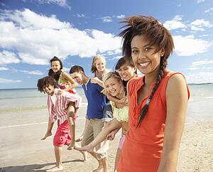 Teenagers walking on beach