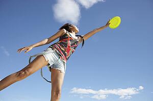 Teenage girl with frisbee