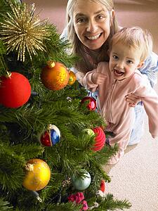 Mother and daughter with Christmas tree