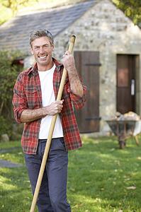 Man working in country garden