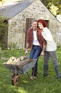 Couple working in country garden
