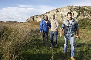 Young men on country walk