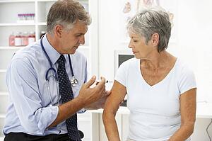 Doctor with female patient