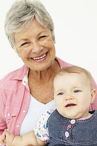 Portrait of senior woman with baby