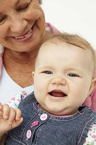 Portrait of senior woman with baby
