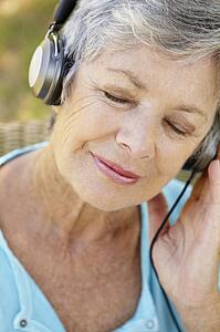 Senior woman with headphone