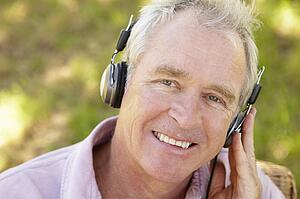 Senior man with headphone