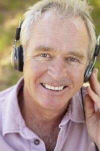 Senior man with headphone