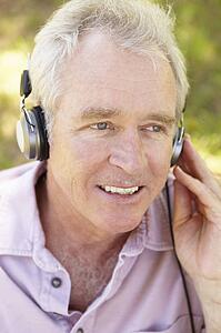 Senior man with headphone