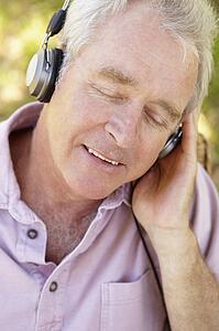 Senior man with headphone