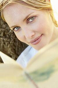 Portrait of young woman reading