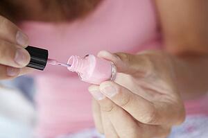 Close up detail teenage girl painting nails