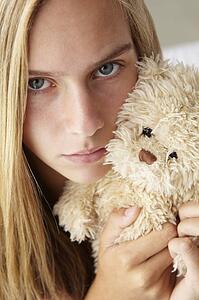 Unhappy teenage girl with cuddly toy