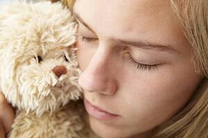 Close up teenage girl with cuddly toy