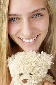 Close up teenage girl with cuddly toy