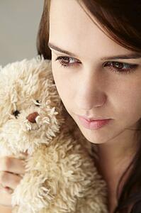Close up teenage girl with cuddly toy
