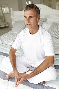 Mid age man in lotus position