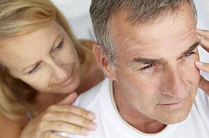 Woman comforting anxious husband