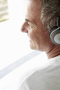 Mid age man wearing headphones