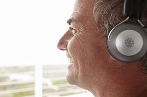 Mid age man wearing headphones