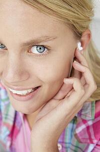 Teenage girl wearing earphones