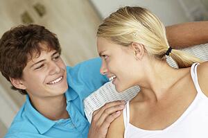 Portrait teenage girl and boy at home
