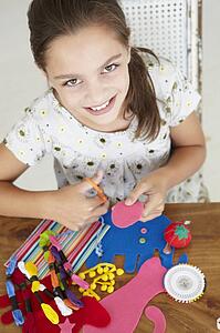 Young girl doing handicrafts