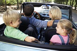 family in sports car