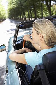 Woman in sports car