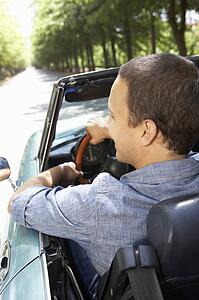 Man in sports car