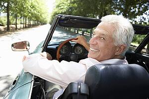 Senior man in sports car