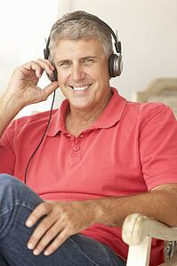 Mid age man wearing headphones