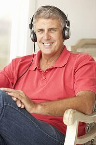 Mid age man wearing headphones