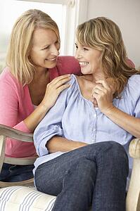 Adult mother and daughter at home
