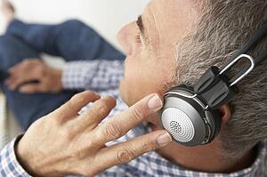 Mid age man wearing headphones