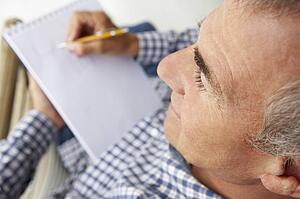 Mid age man sketching