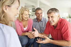 Mid age couples chatting at home